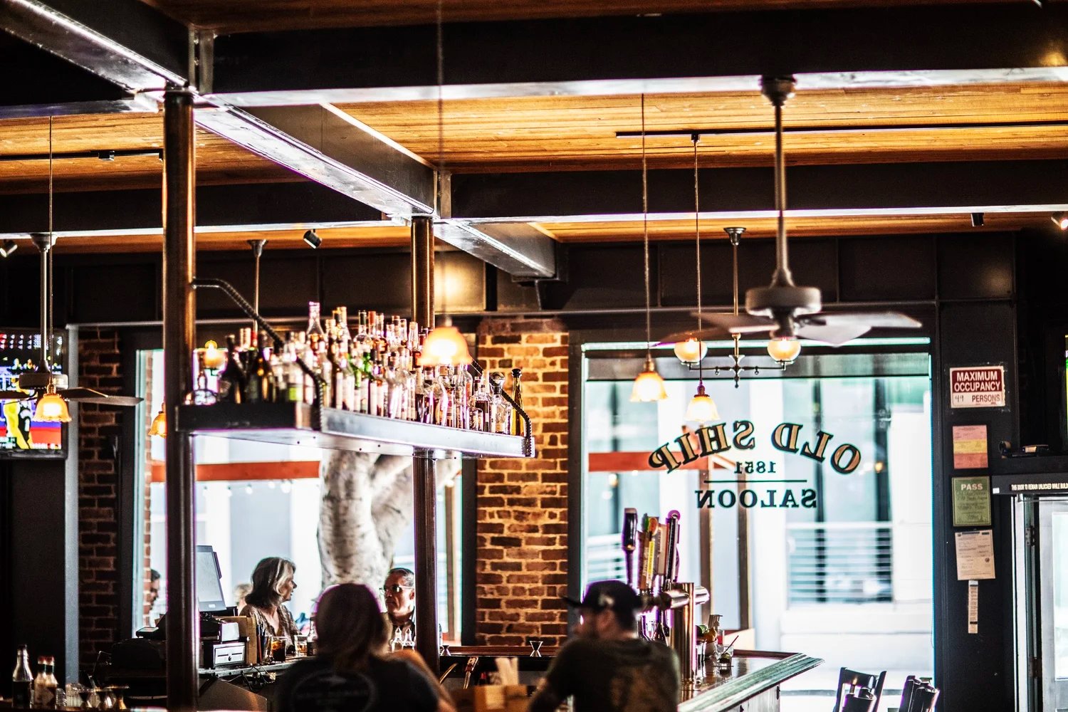 Old Ship Saloon rustic interior with brick walls and 1851 sign